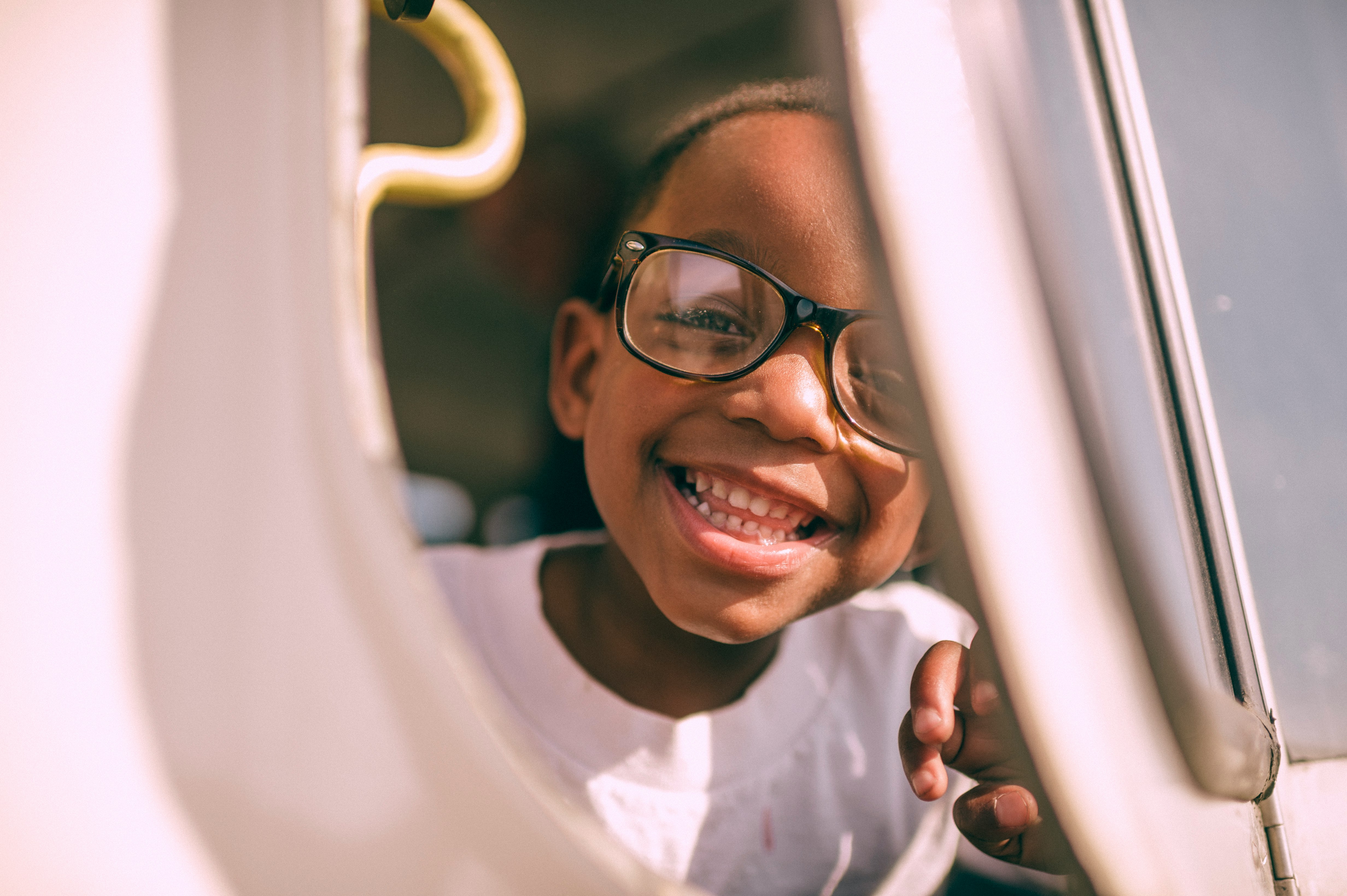 boy taking picture on window